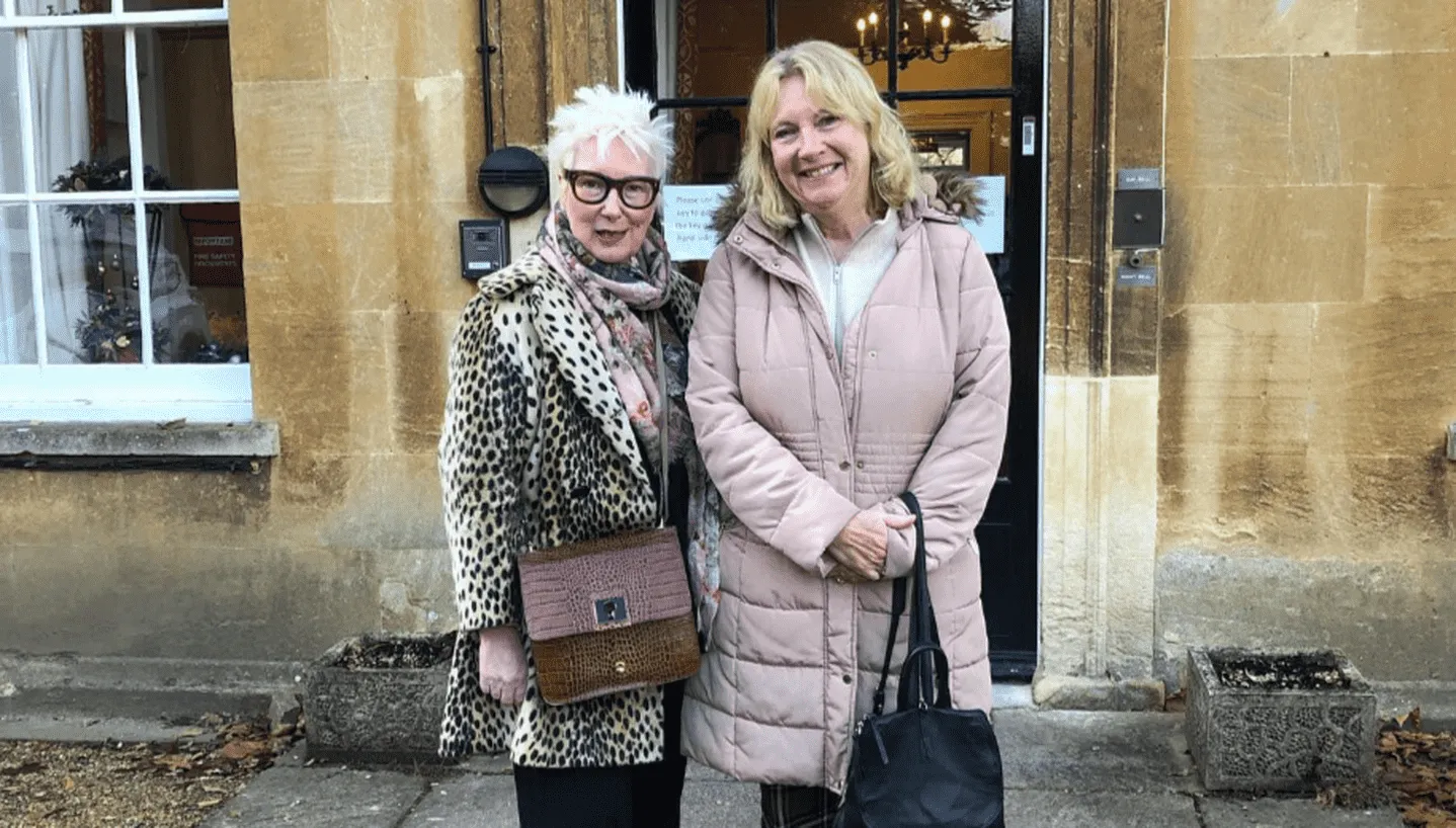 Jenny Eclair and Judith Holder standing outside smiling