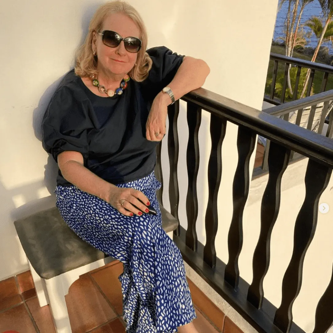 Judith Holder sitting on the balcony of her holiday apartment.