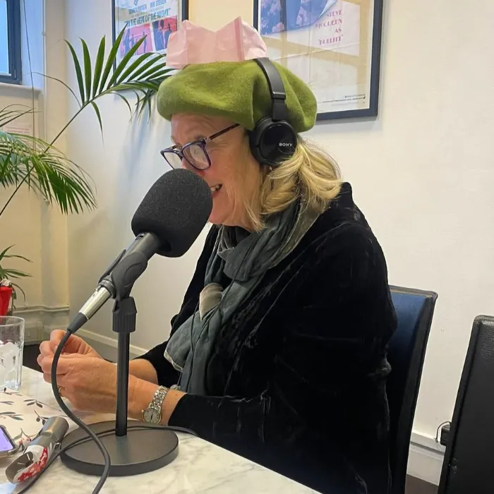 Judith Holder at a festive podcast recording.